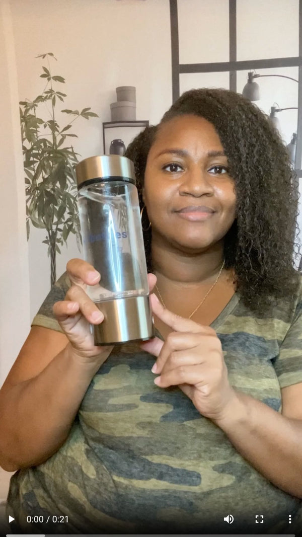 woman holding ionbottles hydrogen water bottle